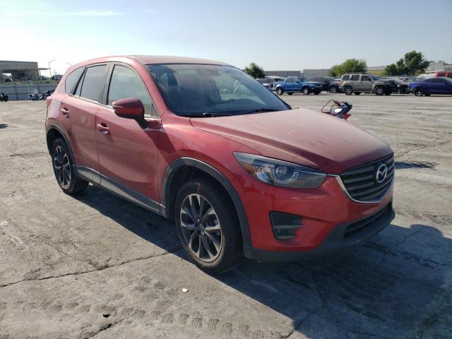 MAZDA CX-5 GT 2016 with VIN JM3KE2DYXG0636058 - Photo from auction