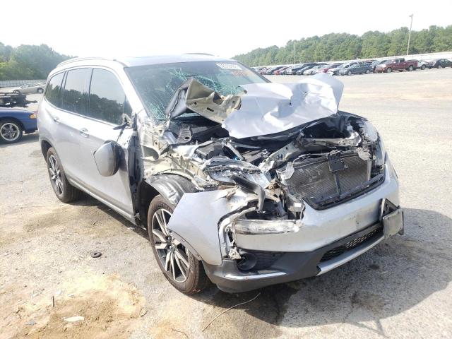 HONDA PILOT TOUR 2019 with VIN 5FNYF6H65KB057344 - Photo from auction