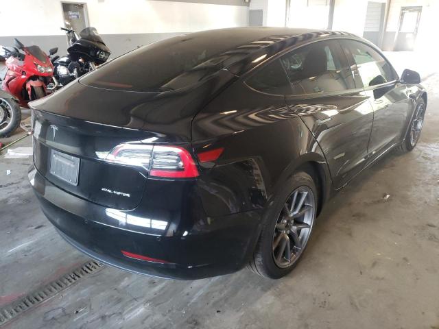 Photo 4 from auction – 2021 TESLA MODEL 3 with VIN 5YJ3E1EBXMF031438