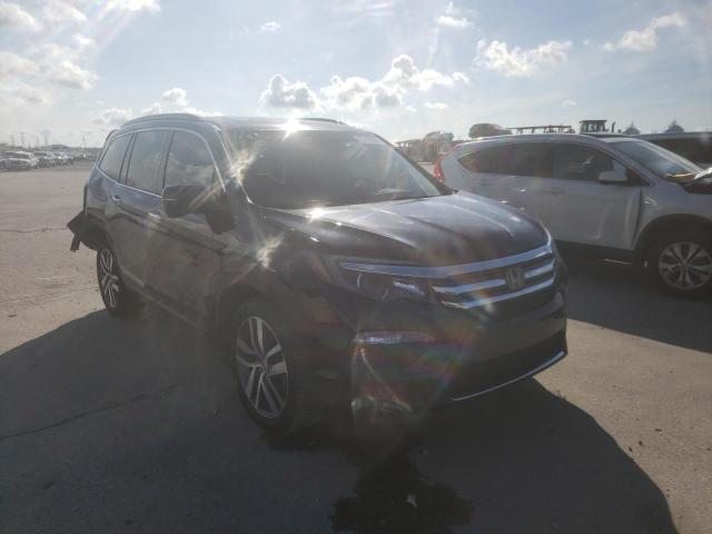 HONDA PILOT TOUR 2017 with VIN 5FNYF5H92HB042572 - Photo from auction