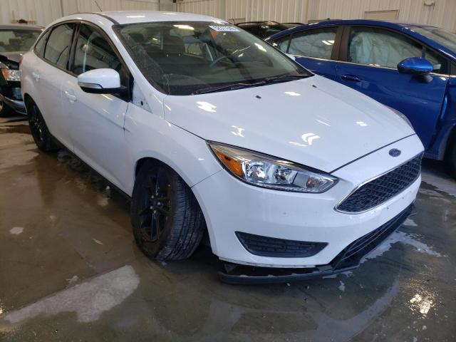 FORD FOCUS SE 2015 with VIN 1FADP3F27FL373170 - Photo from auction