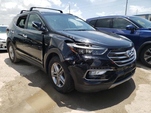 HYUNDAI SANTA FE S 2018 with VIN 5NMZU3LB7JH056934 - Photo from auction