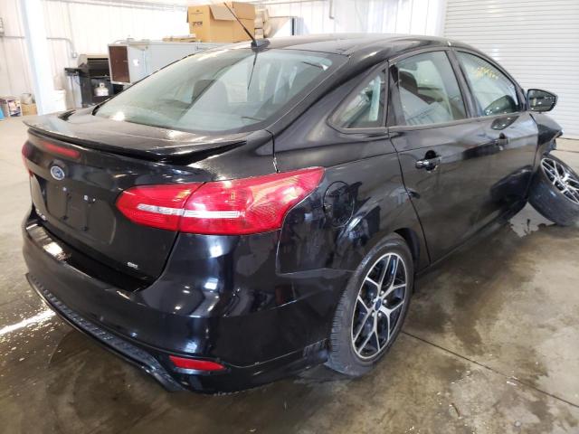 Photo 4 from auction – 2016 FORD FOCUS SE with VIN 1FADP3F20GL203699