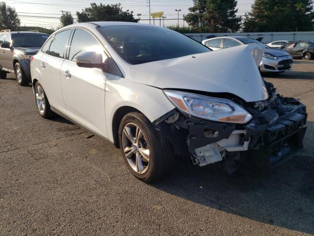 FORD FOCUS SE 2014 with VIN 1FADP3F21EL142943 - Photo from auction