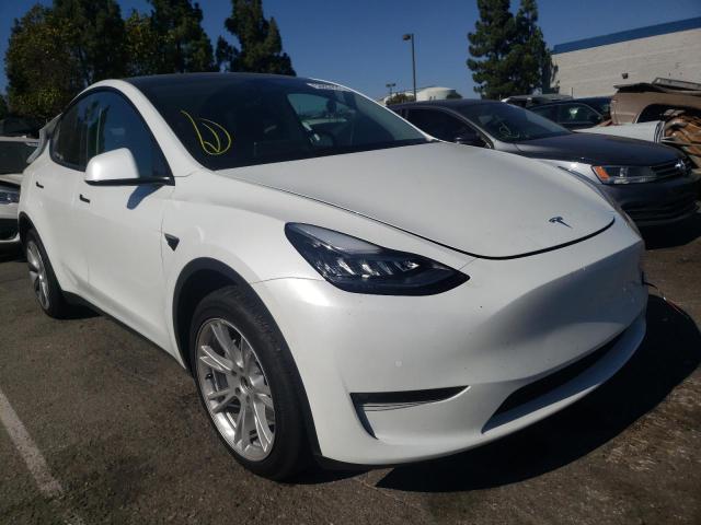 TESLA MODEL Y 2022 with VIN 7SAYGAEE9NF433403 - Photo from auction