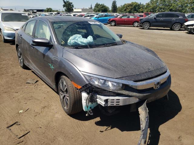 HONDA CIVIC EX 2018 with VIN JHMFC1F49JX034432 - Photo from auction