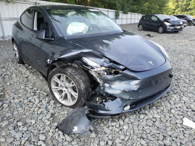 TESLA MODEL Y 2022 with VIN 7SAYGAEE6NF325014 - Photo from auction