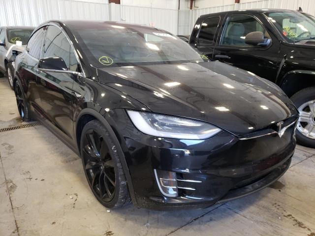 TESLA MODEL X 2018 with VIN 5YJXCBE27JF088429 - Photo from auction