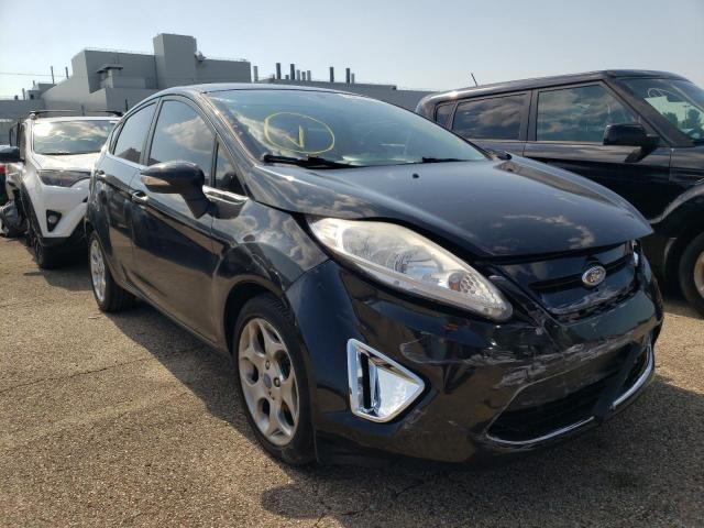FORD FIESTA SES 2011 with VIN 3FADP4FJ5BM219143 - Photo from auction