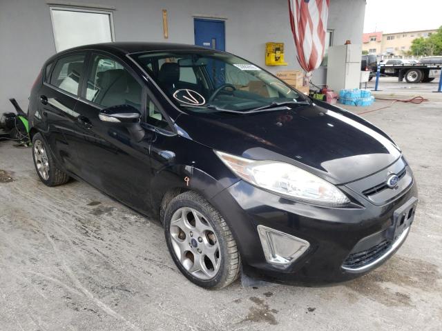 FORD FIESTA SES 2011 with VIN 3FADP4FJ2BM174792 - Photo from auction