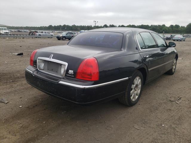 Photo 4 from auction – 2004 LINCOLN TOWN CAR E with VIN 1LNHM84W24Y673945