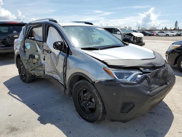 TOYOTA RAV4 LE 2018 with VIN 2T3BFREV7JW698863 - Photo from auction