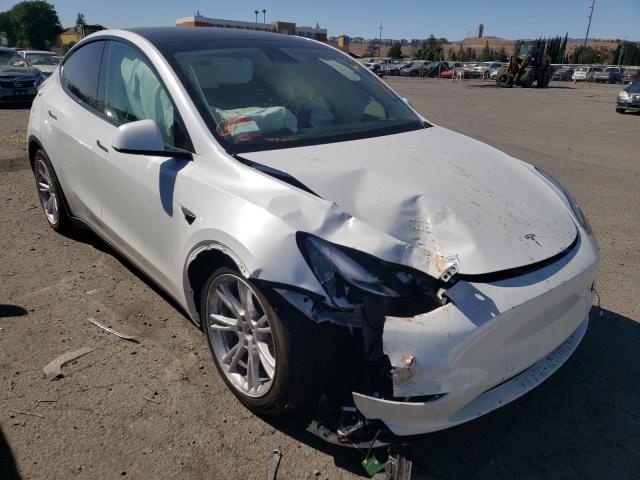 TESLA MODEL Y 2022 with VIN 7SAYGAEE5NF488303 - Photo from auction