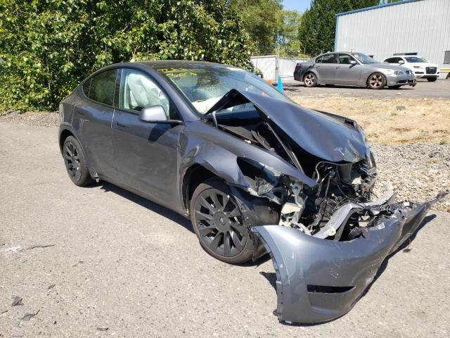 TESLA MODEL Y 2022 with VIN 7SAYGAEE7NF394147 - Photo from auction
