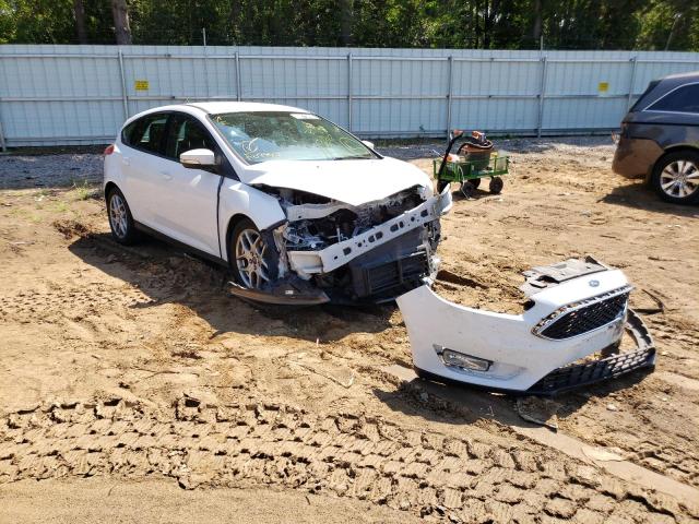 FORD FOCUS SE 2015 with VIN 1FADP3K28FL264738 - Photo from auction