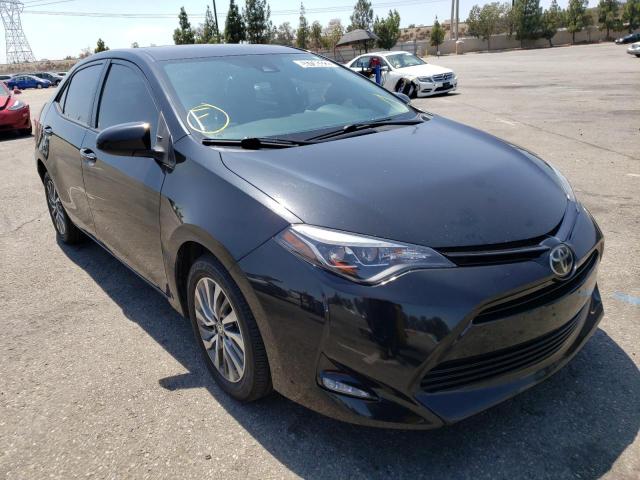 TOYOTA COROLLA L 2018 with VIN 5YFBURHE8JP758841 - Photo from auction