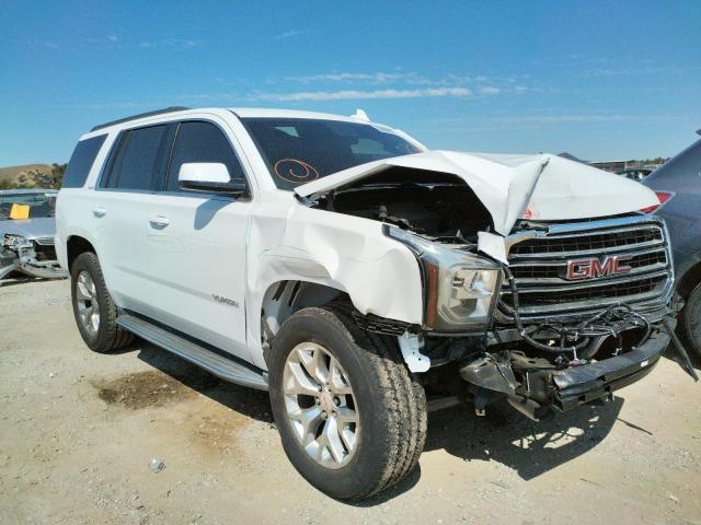GMC YUKON SLE 2015 with VIN 1GKS1AKC4FR677693 - Photo from auction