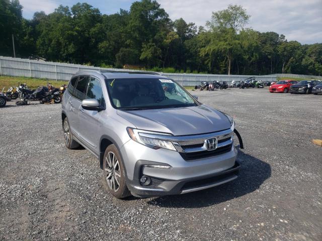 HONDA PILOT TOUR 2020 with VIN 5FNYF6H93LB035967 - Photo from auction