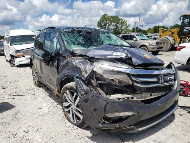HONDA PILOT TOUR 2016 with VIN 5FNYF5H96GB050351 - Photo from auction
