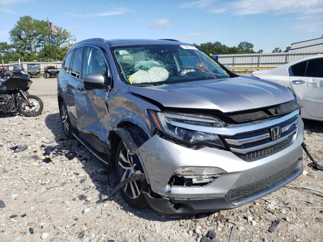 HONDA PILOT TOUR 2017 with VIN 5FNYF5H90HB010526 - Photo from auction