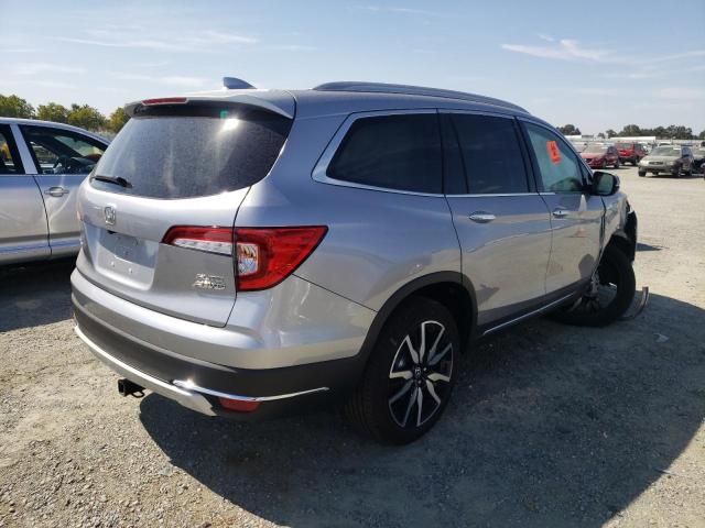 Photo 4 from auction – 2022 HONDA PILOT ELIT with VIN 5FNYF6H02NB002365
