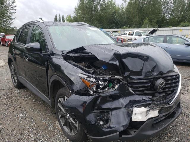 MAZDA CX-5 GT 2016 with VIN JM3KE4DY8G0665831 - Photo from auction