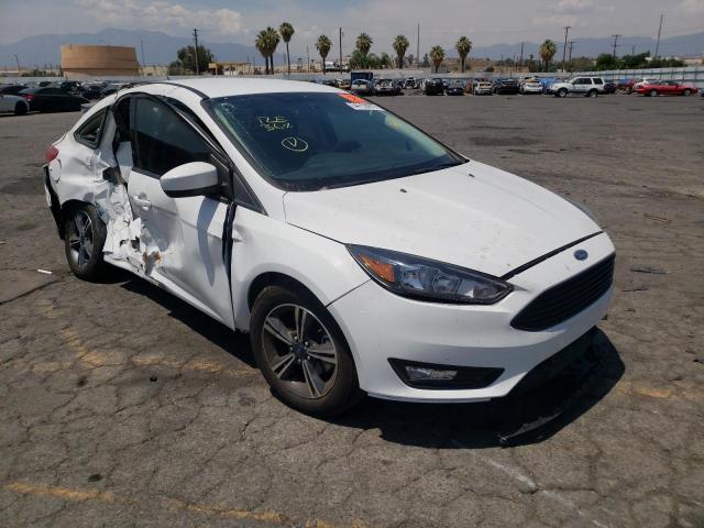 FORD FOCUS SE 2018 with VIN 1FADP3FE1JL240889 - Photo from auction