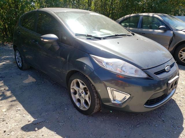 FORD FIESTA SES 2011 with VIN 3FADP4FJ0BM119676 - Photo from auction