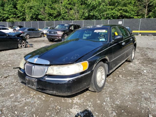 Photo 2 from auction – 2000 LINCOLN TOWN CAR E with VIN 1LNHM81W3YY796907