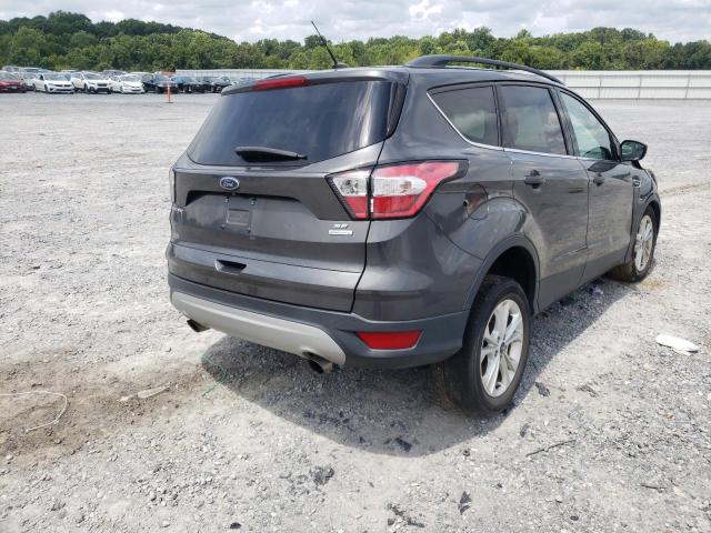 Photo 4 from auction – 2018 FORD ESCAPE SE with VIN 1FMCU0GD8JUC10975