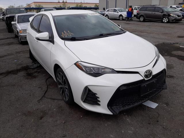 TOYOTA COROLLA L 2018 with VIN 5YFBURHE6JP779980 - Photo from auction