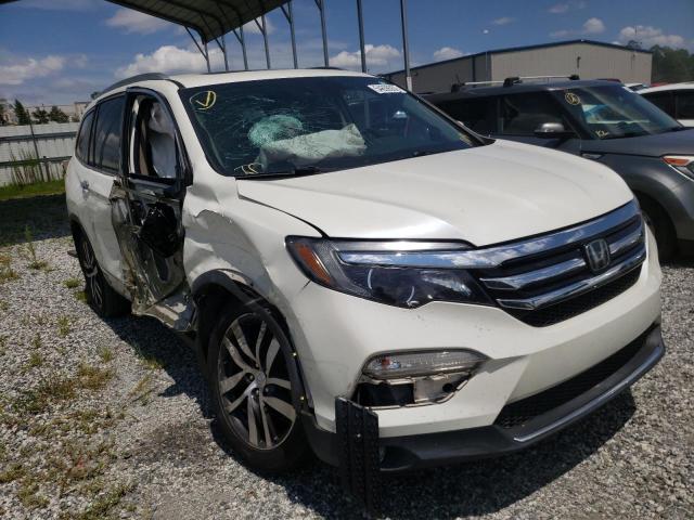 HONDA PILOT TOUR 2016 with VIN 5FNYF5H91GB051472 - Photo from auction