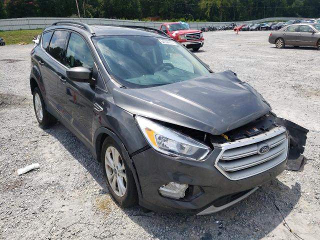 FORD ESCAPE SE 2018 with VIN 1FMCU0GD8JUC10975 - Photo from auction