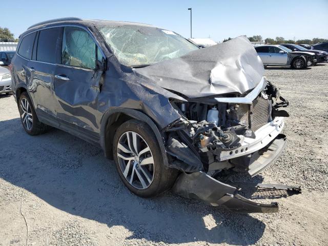 HONDA PILOT TOUR 2018 with VIN 5FNYF6H98JB033869 - Photo from auction