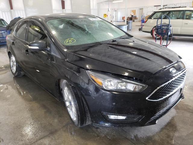 FORD FOCUS SE 2015 with VIN 1FADP3F20FL374385 - Photo from auction