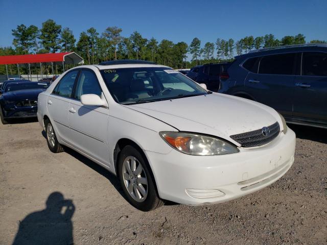 TOYOTA CAMRY LE 2002 with VIN JTDBF32K420011349 - Photo from auction