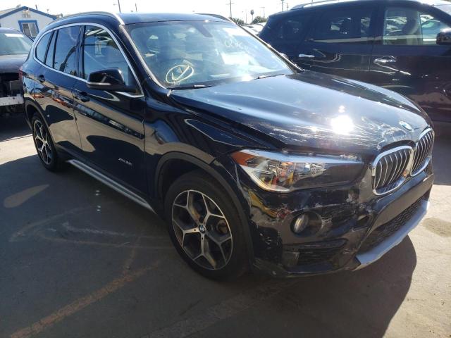 BMW X1 XDRIVE2 2018 with VIN WBXHT3Z31J4A67053 - Photo from auction