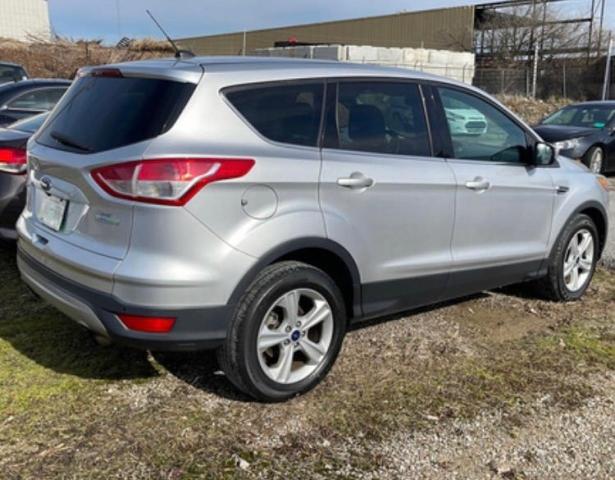 Photo 4 from auction – 2014 FORD ESCAPE SE with VIN 1FMCU0G99EUD58943