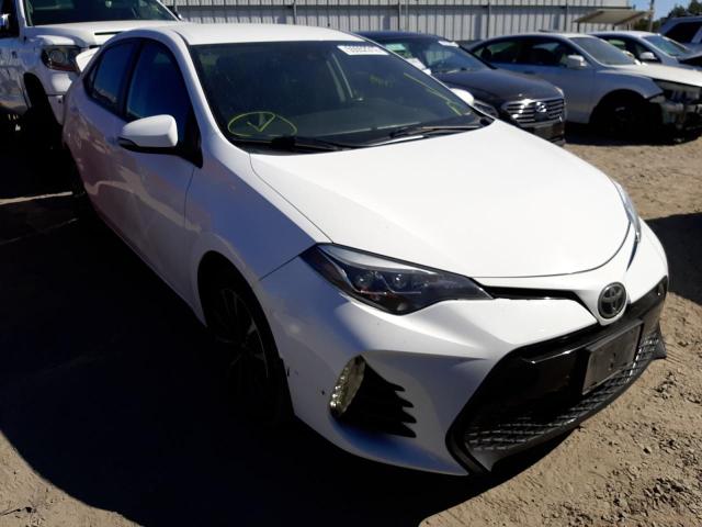 TOYOTA COROLLA L 2017 with VIN 5YFBURHE9HP696196 - Photo from auction