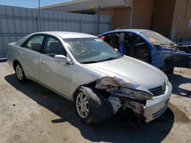 TOYOTA CAMRY LE 2004 with VIN 4T1BF30K44U077538 - Photo from auction