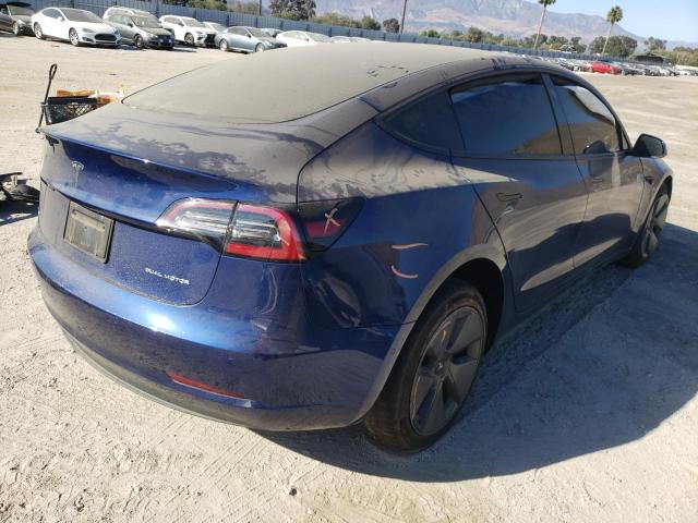 Photo 4 from auction – 2021 TESLA MODEL 3 with VIN 5YJ3E1EBXMF999815