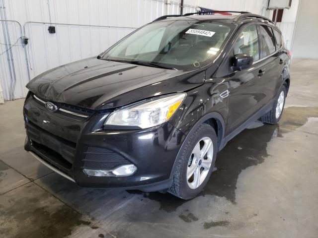 Photo 2 from auction – 2014 FORD ESCAPE SE with VIN 1FMCU9G98EUE40635