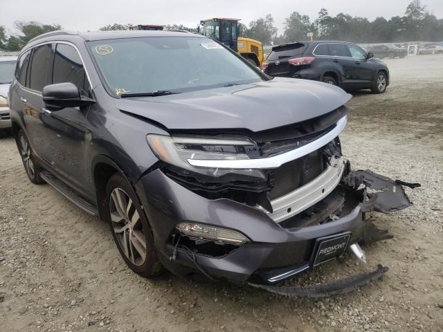 HONDA PILOT TOUR 2016 with VIN 5FNYF5H97GB003362 - Photo from auction