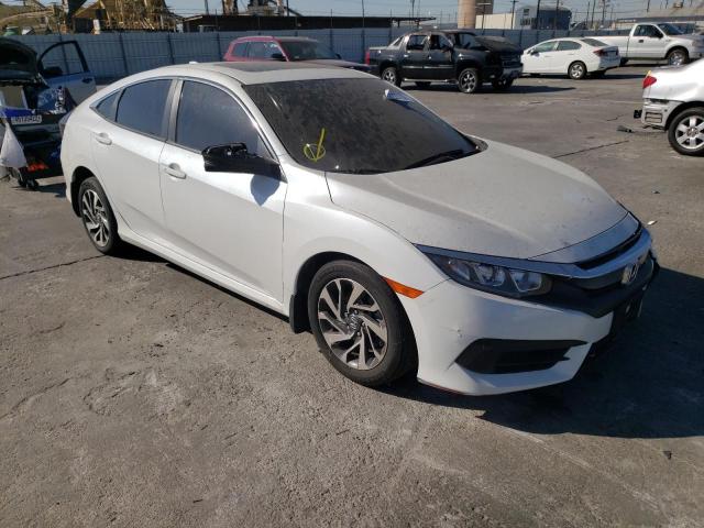 HONDA CIVIC EX 2018 with VIN 19XFC2F70JE207465 - Photo from auction