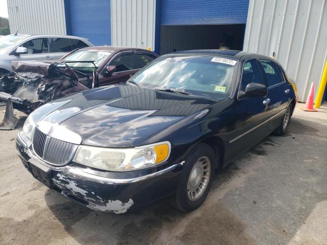 Photo 2 from auction – 2001 LINCOLN TOWN CAR E with VIN 1LNHM81W11Y613218