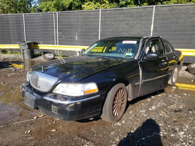 Photo 2 from auction – 2004 LINCOLN TOWN CAR E with VIN 1LNHM81W94Y614041