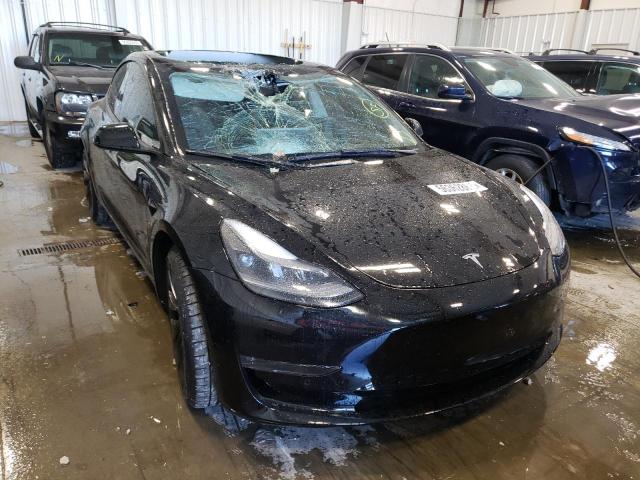 TESLA MODEL 3 2022 with VIN 5YJ3E1EC5NF168331 - Photo from auction