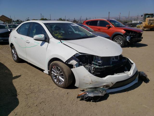 TOYOTA COROLLA L 2014 with VIN 5YFBURHE7EP046097 - Photo from auction