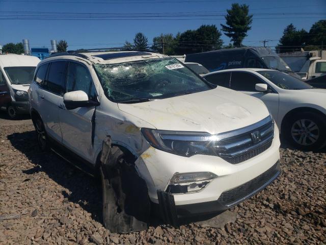 HONDA PILOT TOUR 2016 with VIN 5FNYF6H9XGB099459 - Photo from auction