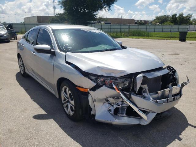 HONDA CIVIC LX 2018 with VIN 19XFC2F50JE038966 - Photo from auction
